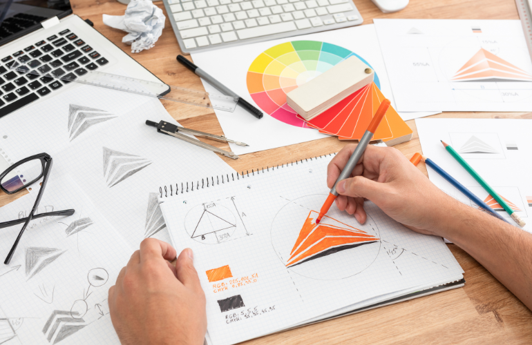 color psychology and influencing consumer behavior - picture of someone designing a brand logo